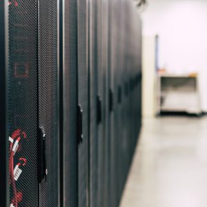 High-tech data center featuring multiple server racks with advanced equipment.